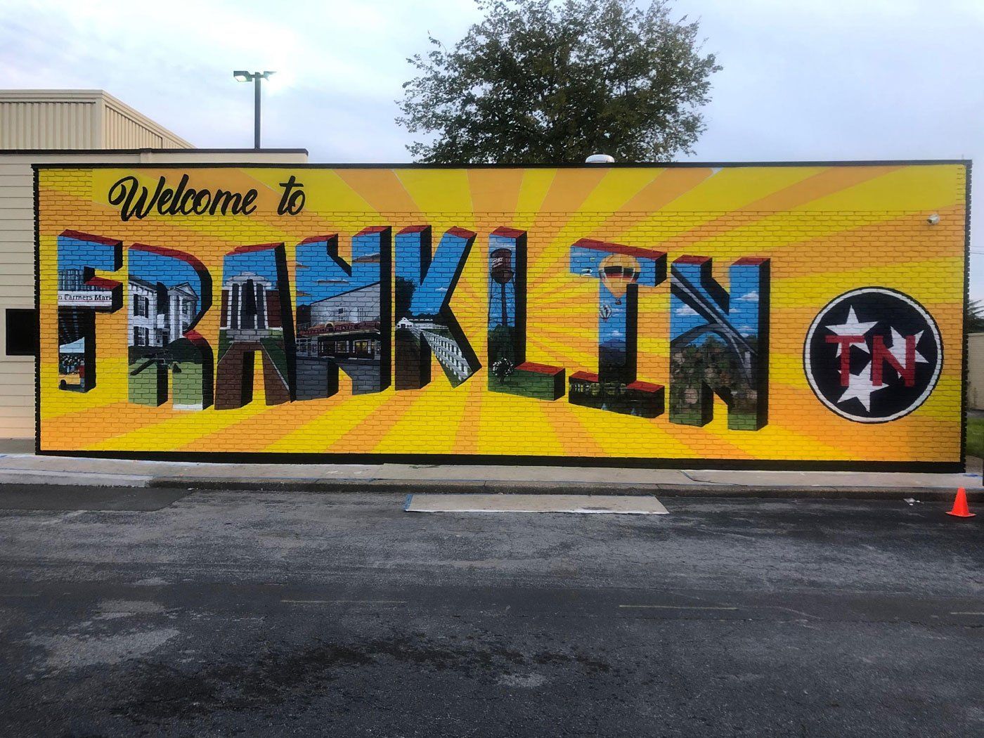 A large yellow sign that says welcome to franklin