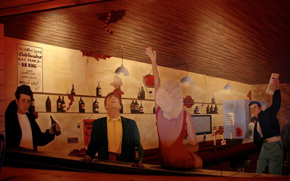 A painting of people sitting at a bar with their arms in the air