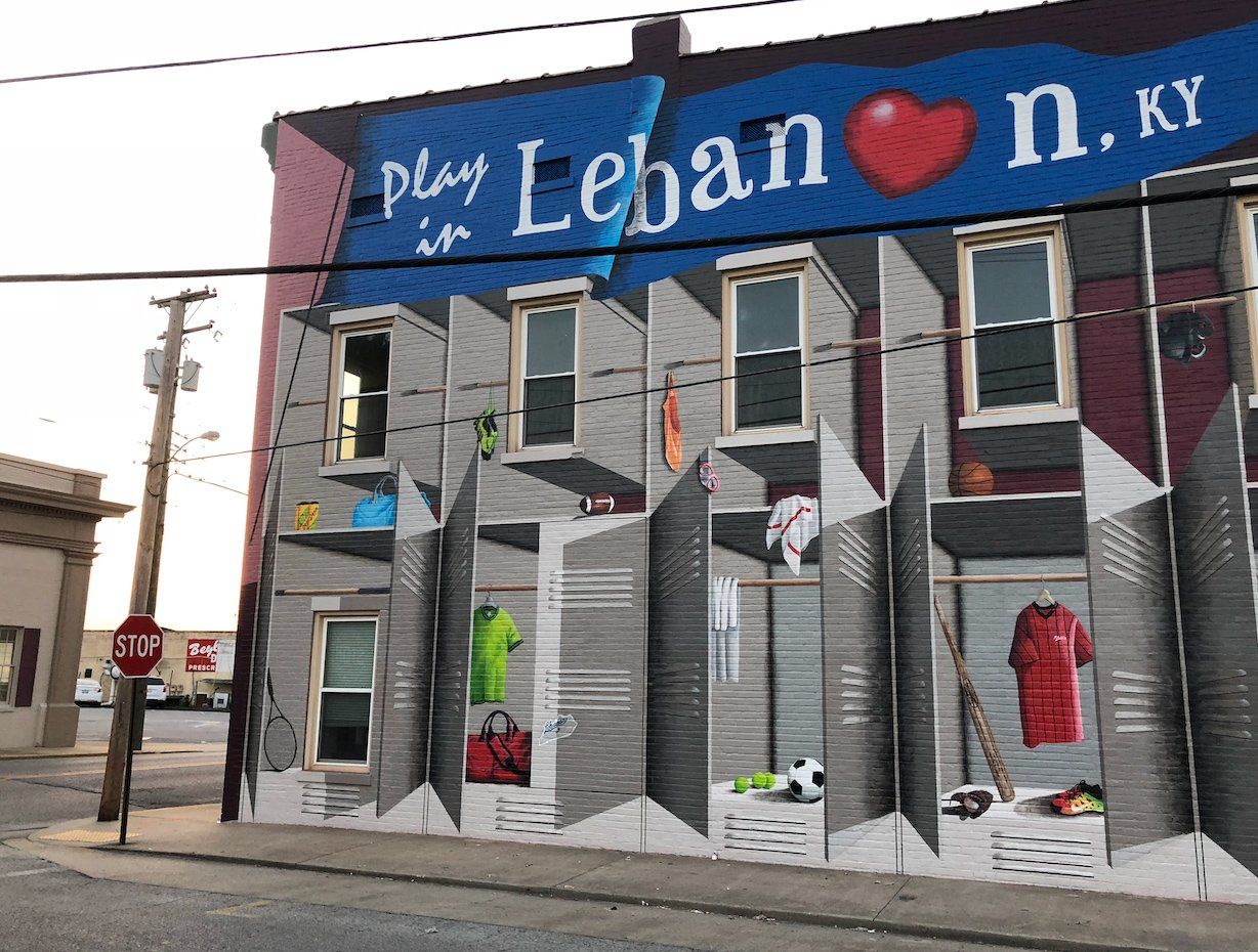 A mural on the side of a building says play in lebanon ky