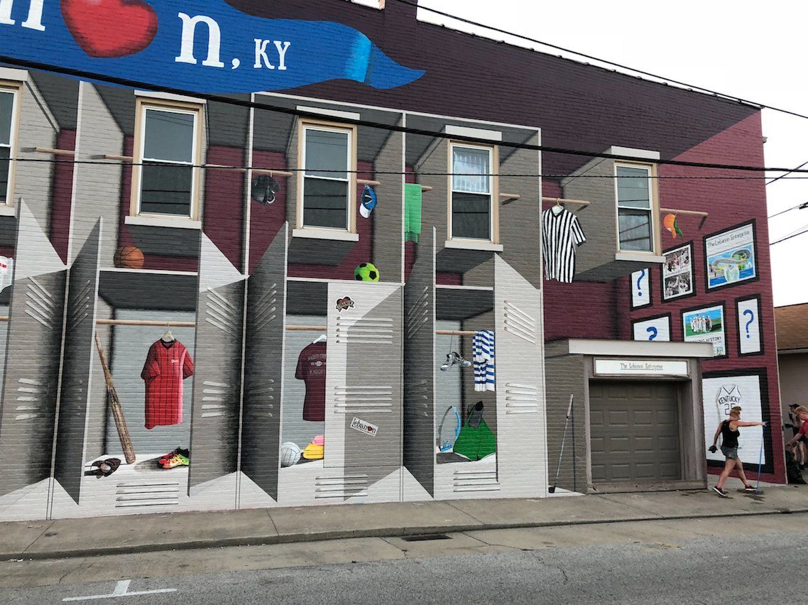 A mural on the side of a building that says n. ky