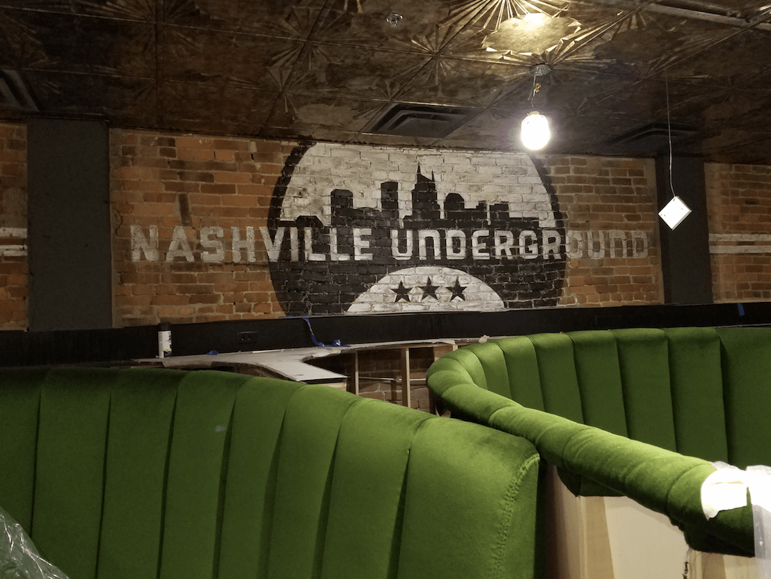 A restaurant with a sign on the wall that says nashville underground.