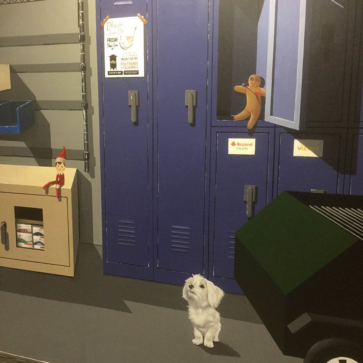 A small white dog standing in front of a row of blue lockers