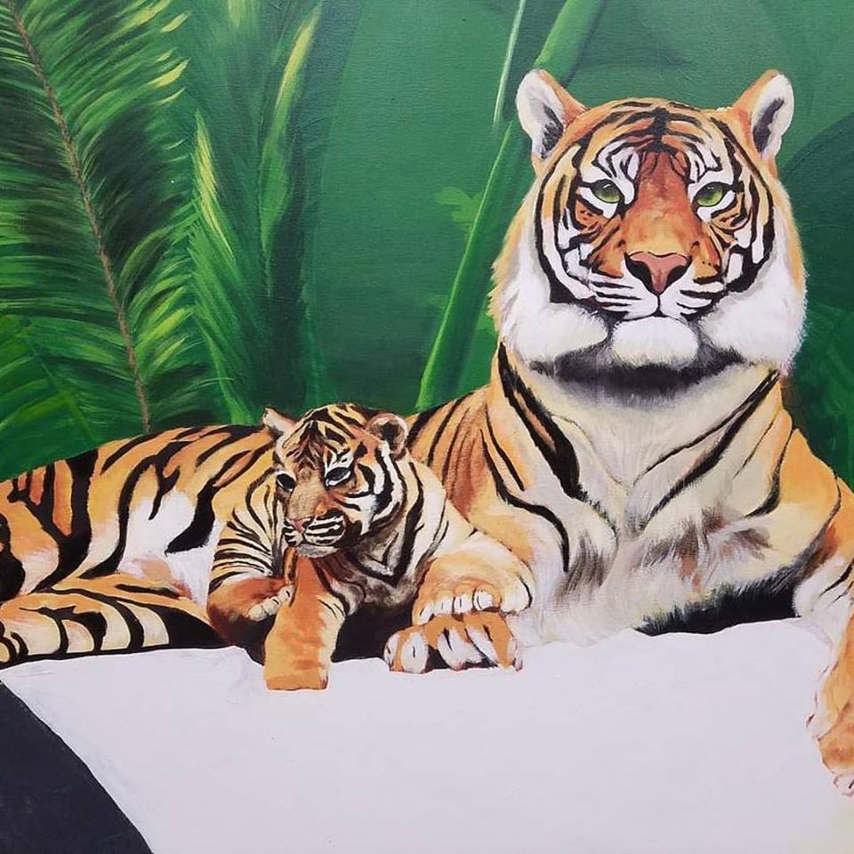 A painting of a mother tiger and her cub