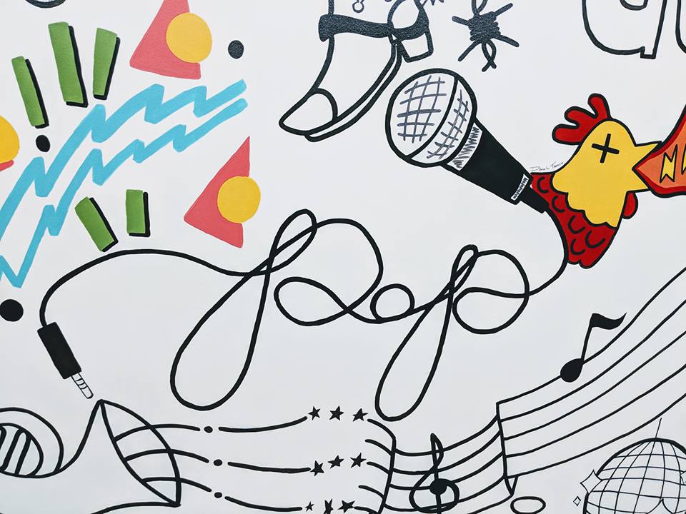 A drawing of a rooster singing into a microphone