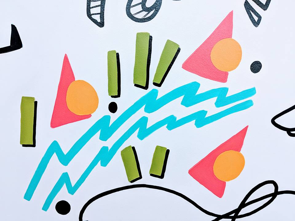 A drawing of colorful geometric shapes on a white background