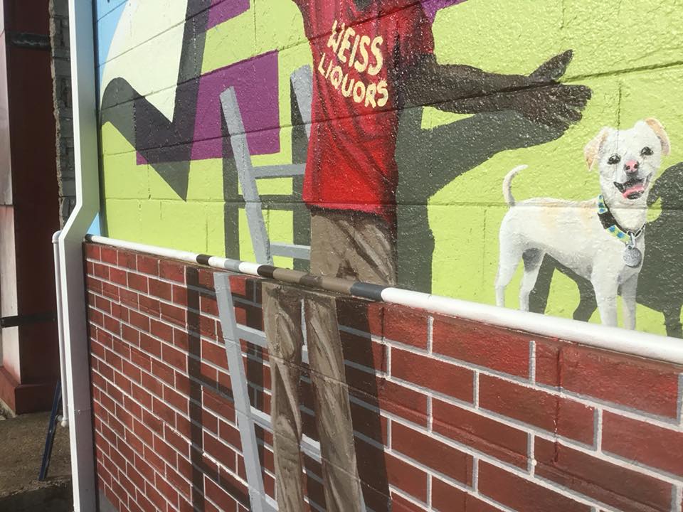 A painting of a man and a dog on a brick wall