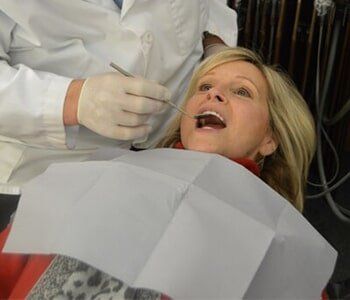 Doctor Checking the Patient's Teeth — Teeth Cleaning in Westlake, OH Doctor Checking the Patient's Teeth — Teeth Cleaning in Westlake, OH
