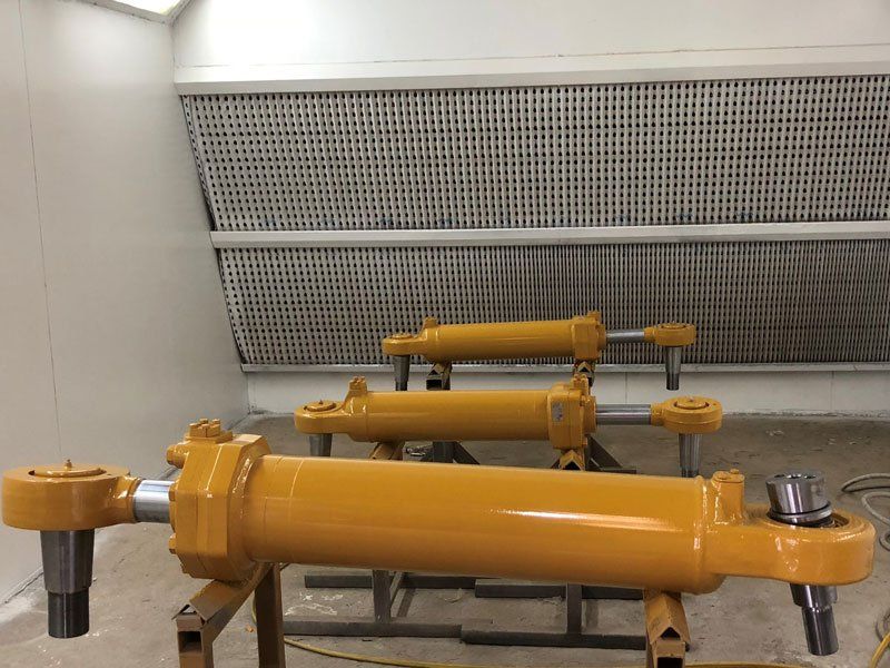 Orange Steer Cylinder — Powder coating service in Tomago, NSW Orange Steer Cylinder — Powder coating service in Tomago, NSW