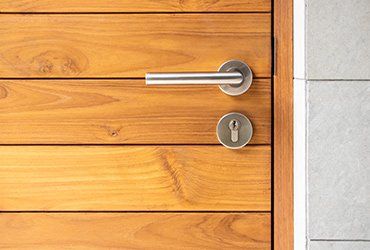 Stainless Steel Door Handle and Wooden Door — Napa, CA — North Bay Plywood