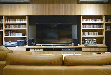 Sofa In Front of TV Shelf Cabinet — Napa, CA — North Bay Plywood