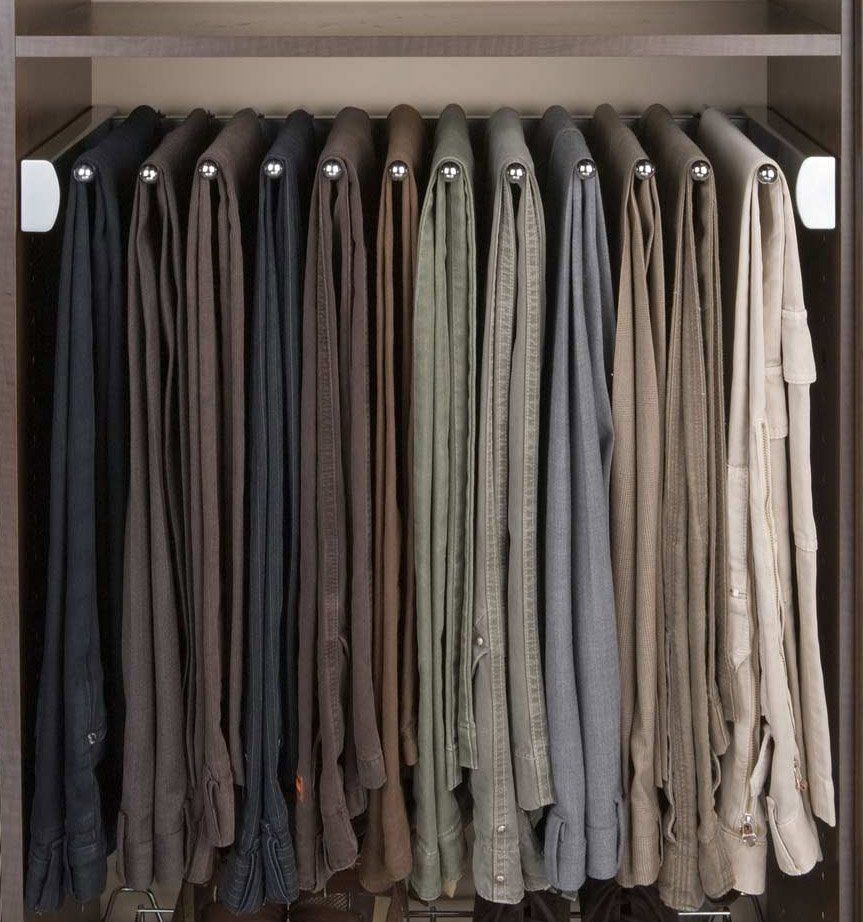 A closet filled with a variety of shirts and pants