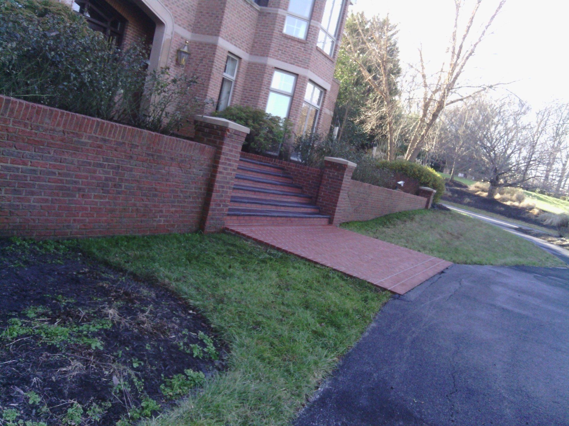A large brick building with stairs leading up to it