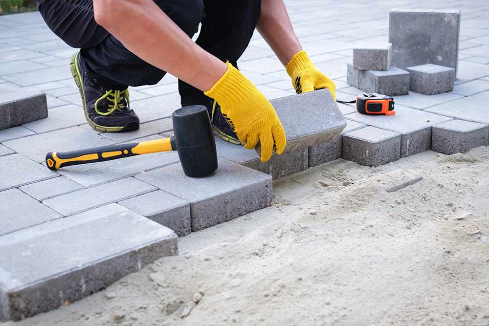 Laying Paving Stones — Landscaping and Excavation Services in Cameron Park, NSW