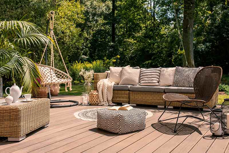 Rattan Patio On A Wooden Deck — Landscaping and Excavation Services in Cameron Park, NSW