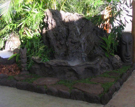 View of water feature made from big rock