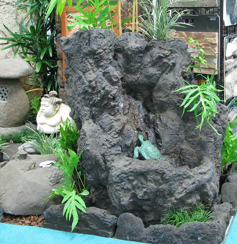 View of garden water feature built from big rock