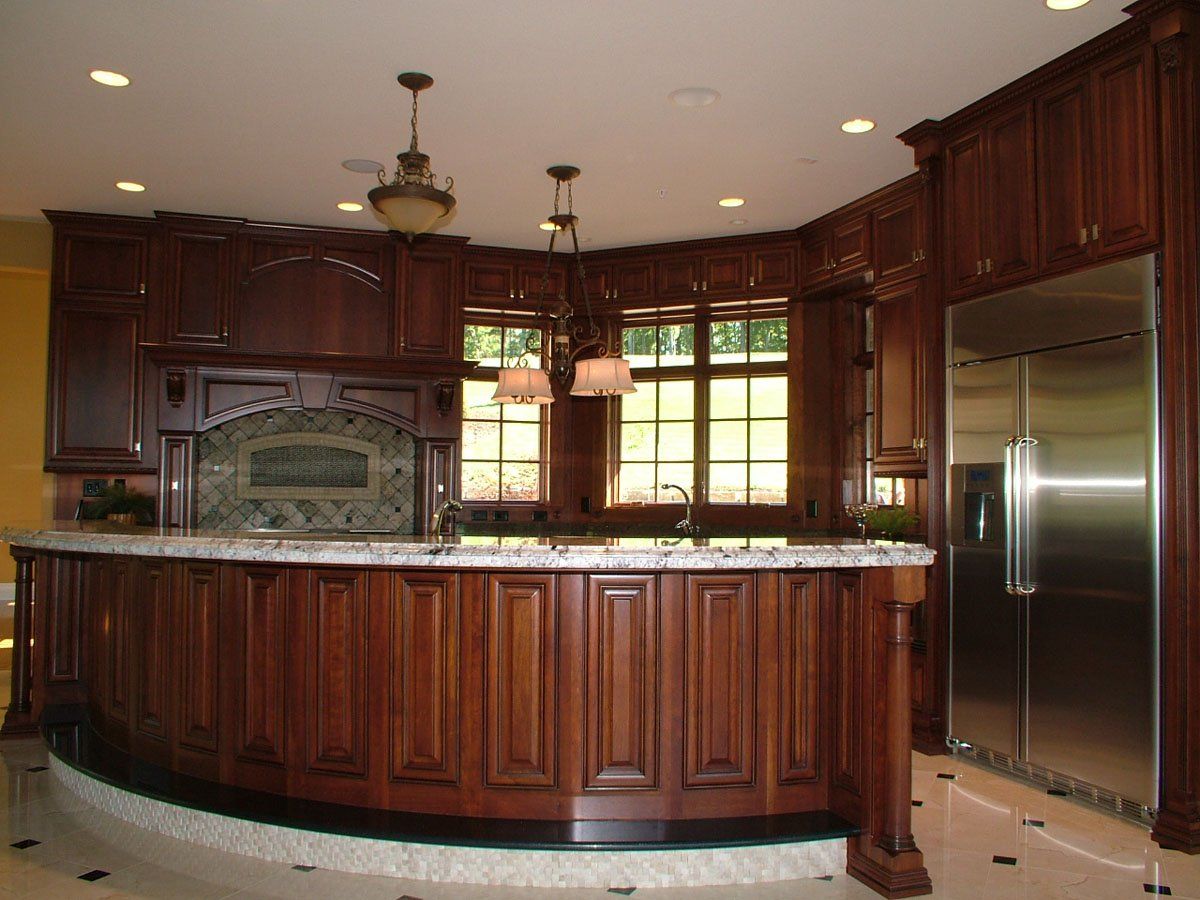 A kitchen with stainless steel appliances and wooden cabinets