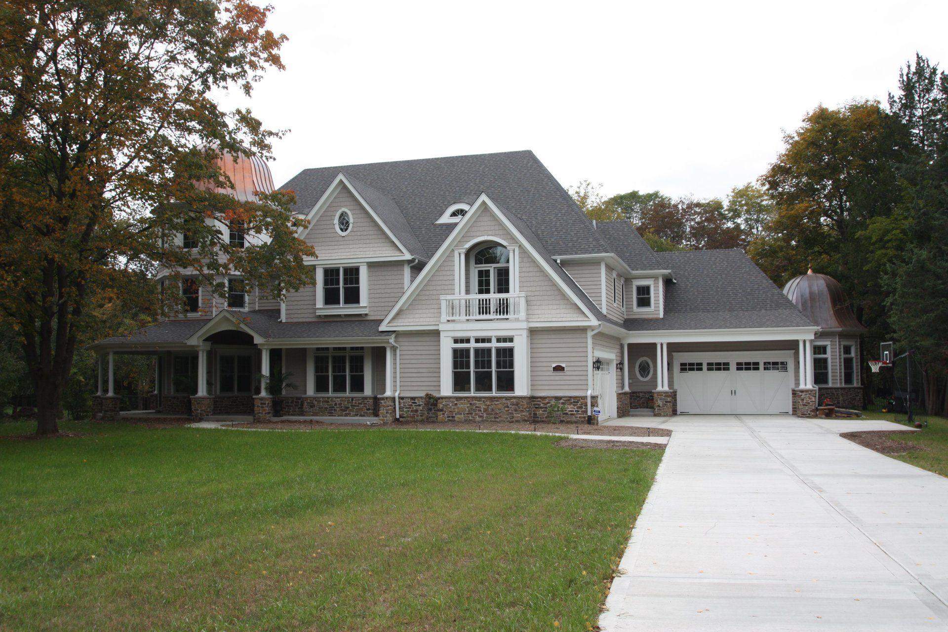A large white house with a gray roof