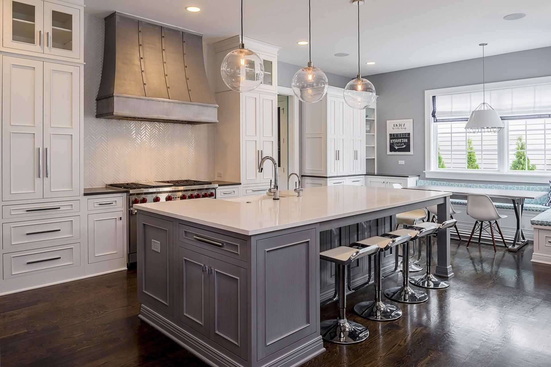 A kitchen with a large island in the middle of it.