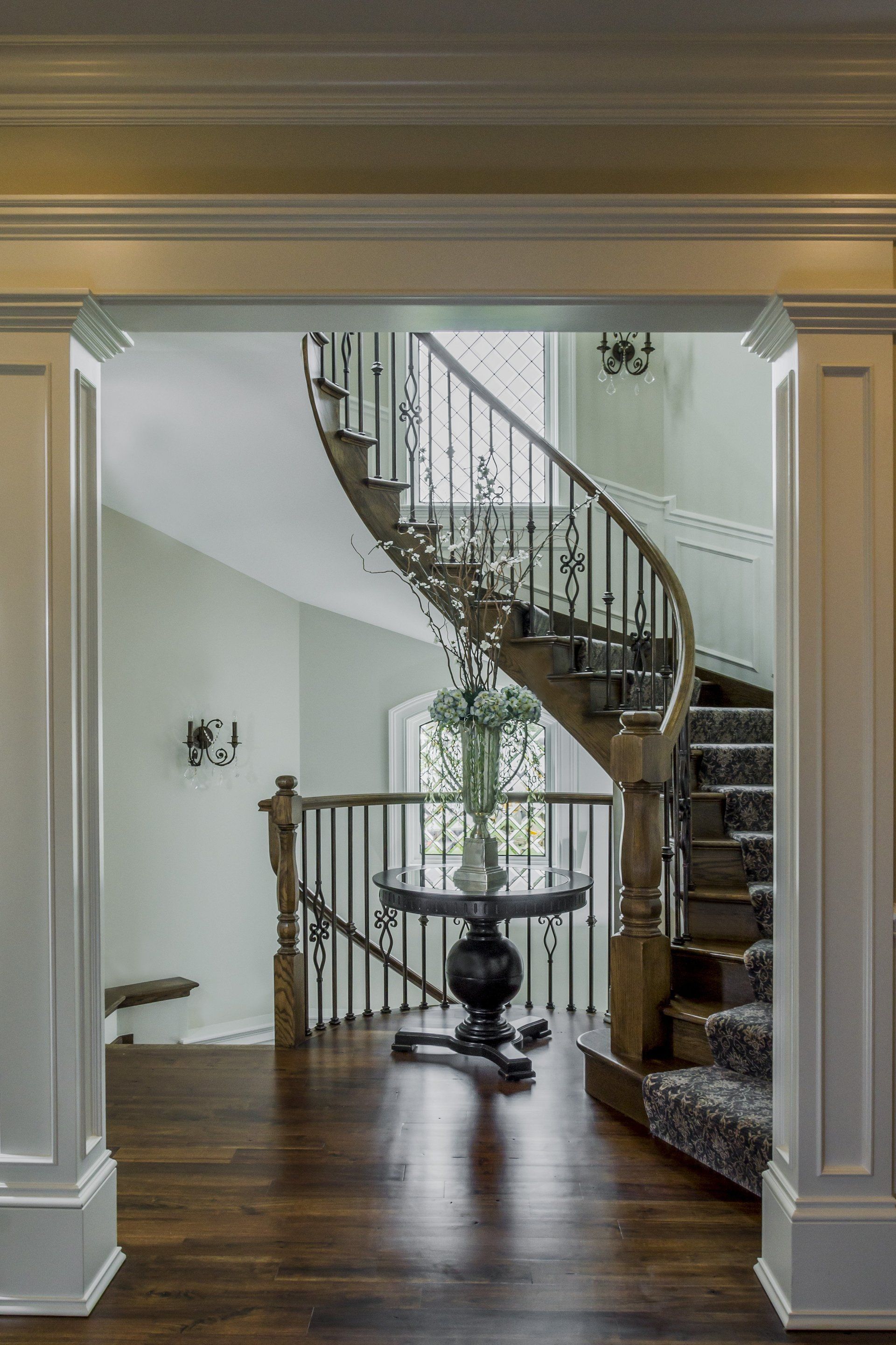 A view of a staircase from a doorway in a house.