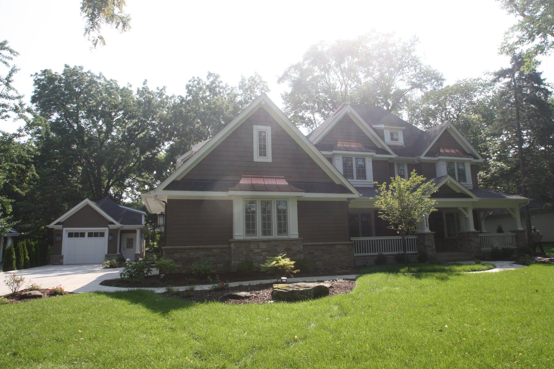 A large house with a lush green lawn in front of it