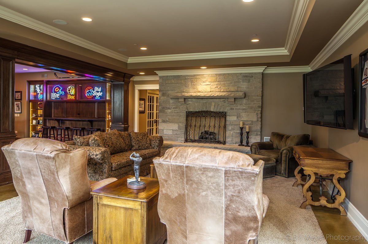 A living room filled with furniture and a fireplace.