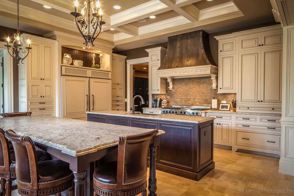 There is a large island in the middle of the kitchen.