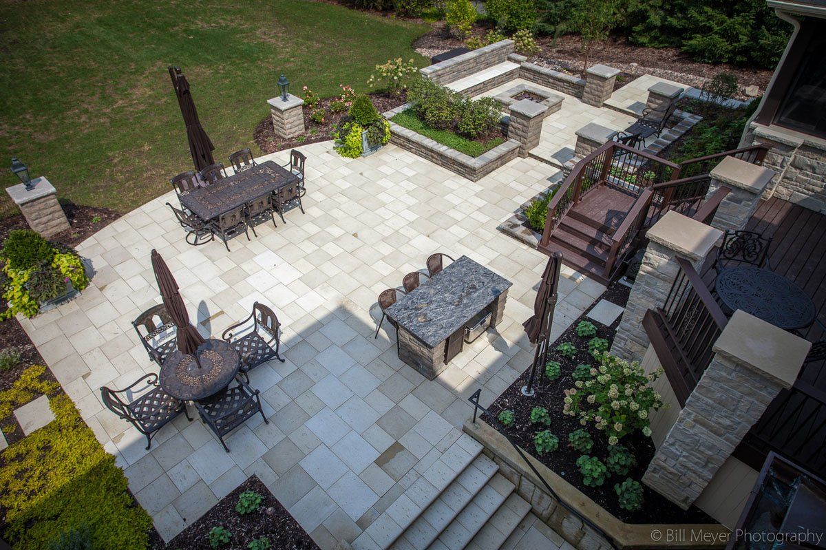 An aerial view of a patio with a table and chairs