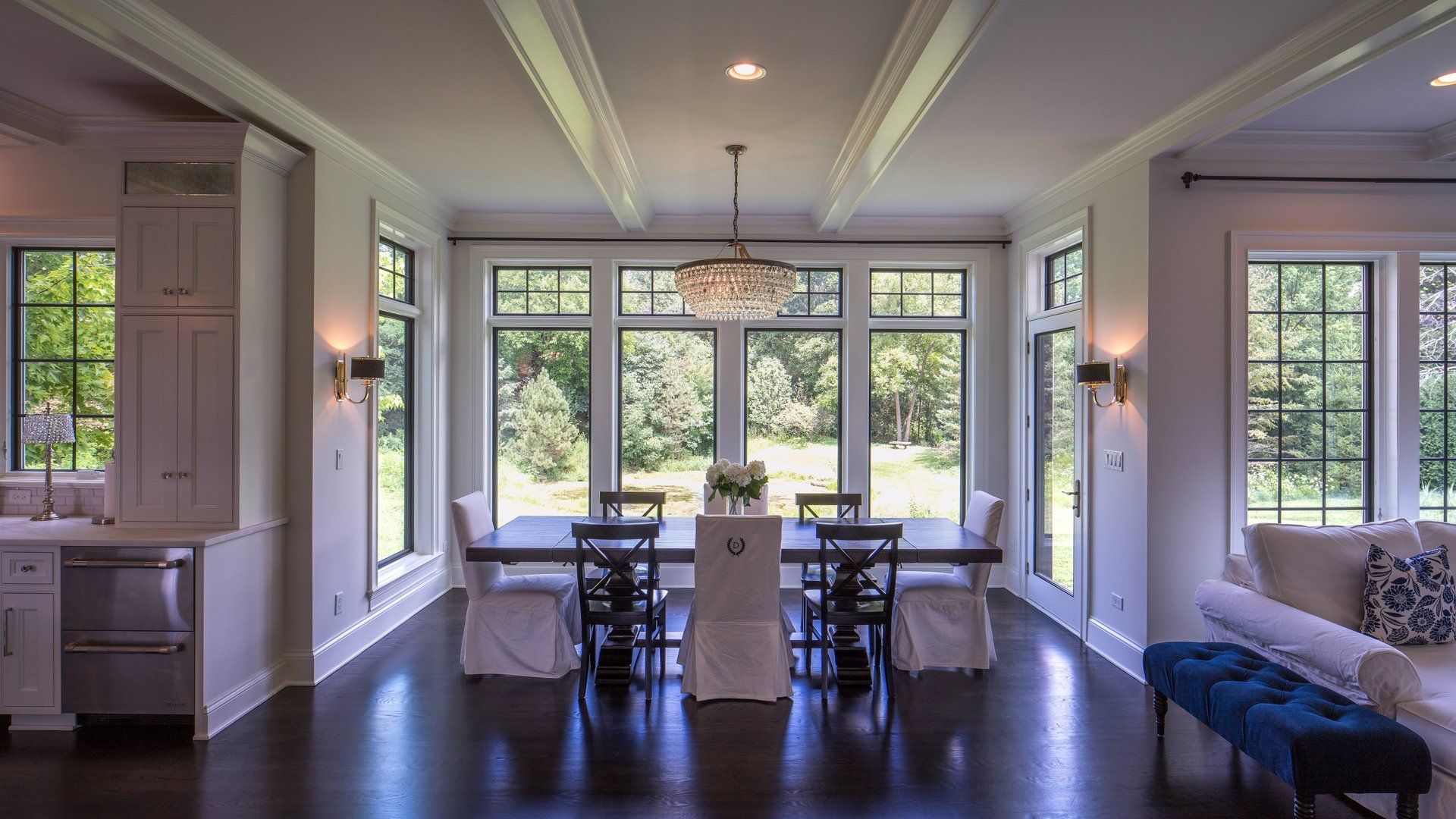 There is a dining room table and chairs in the middle of the room.
