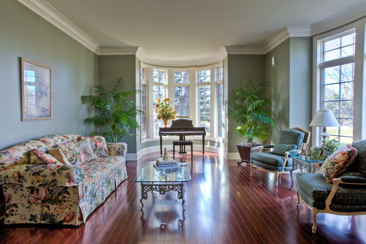 A living room filled with furniture and a piano.
