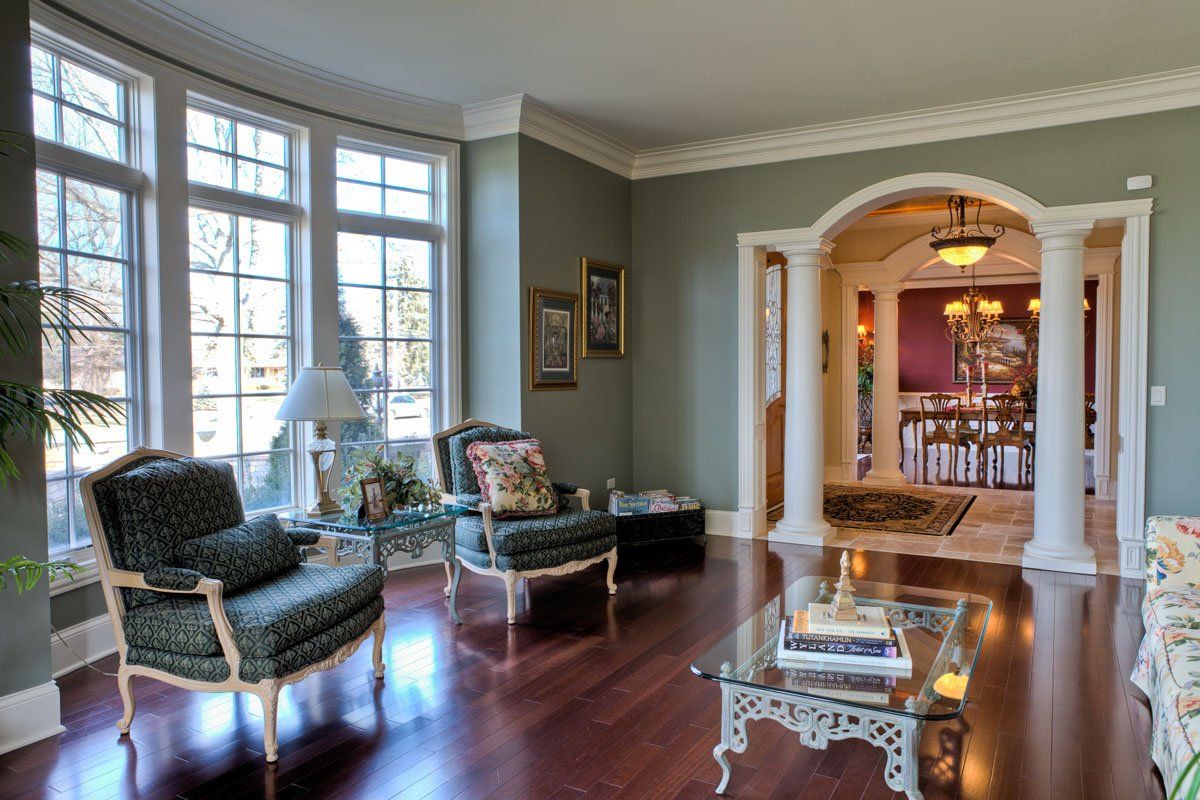 A living room filled with furniture and a glass coffee table.