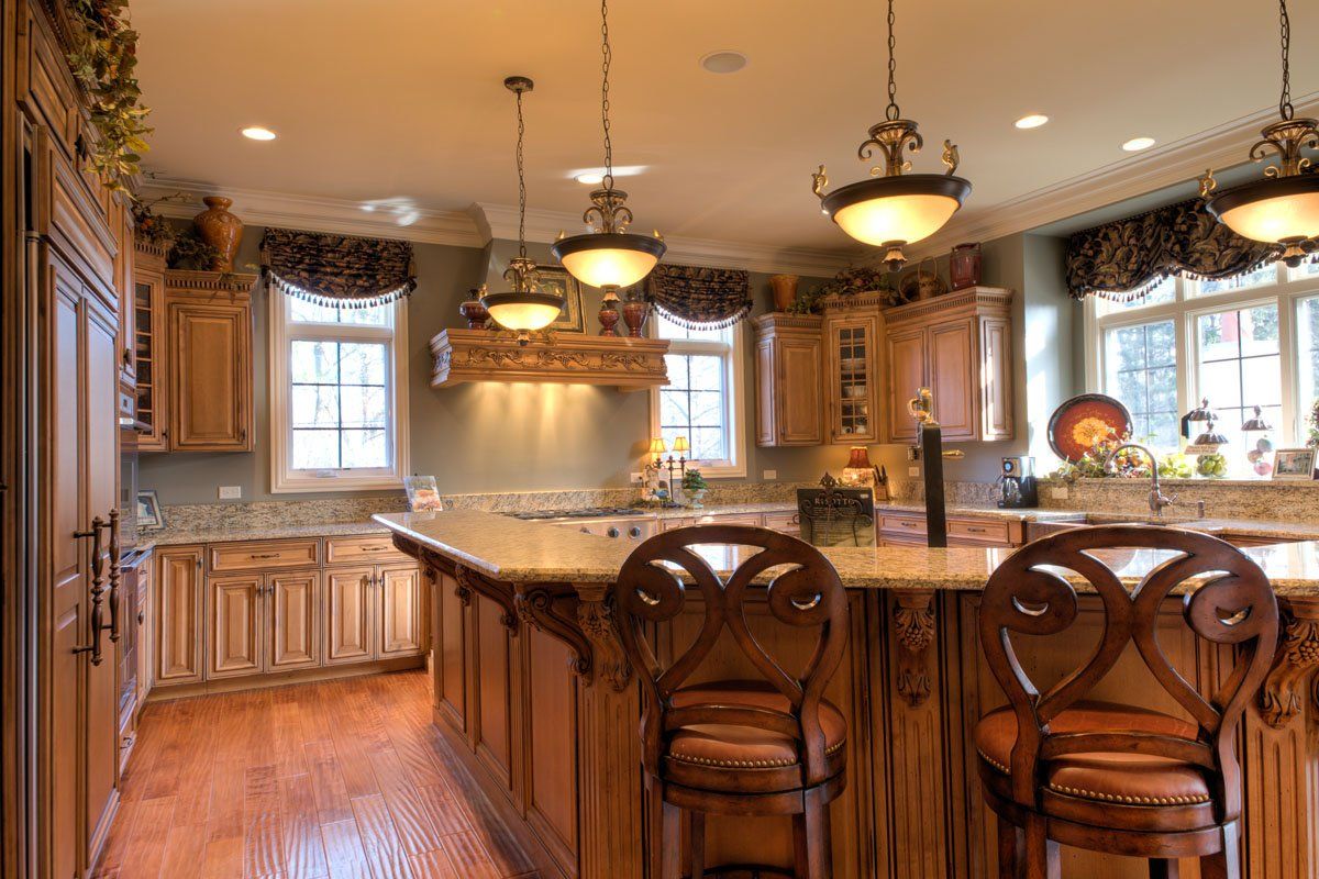 A kitchen with wooden cabinets and granite counter tops