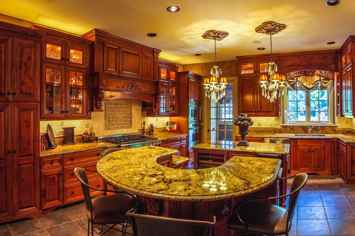 A kitchen with a large island in the middle of it.