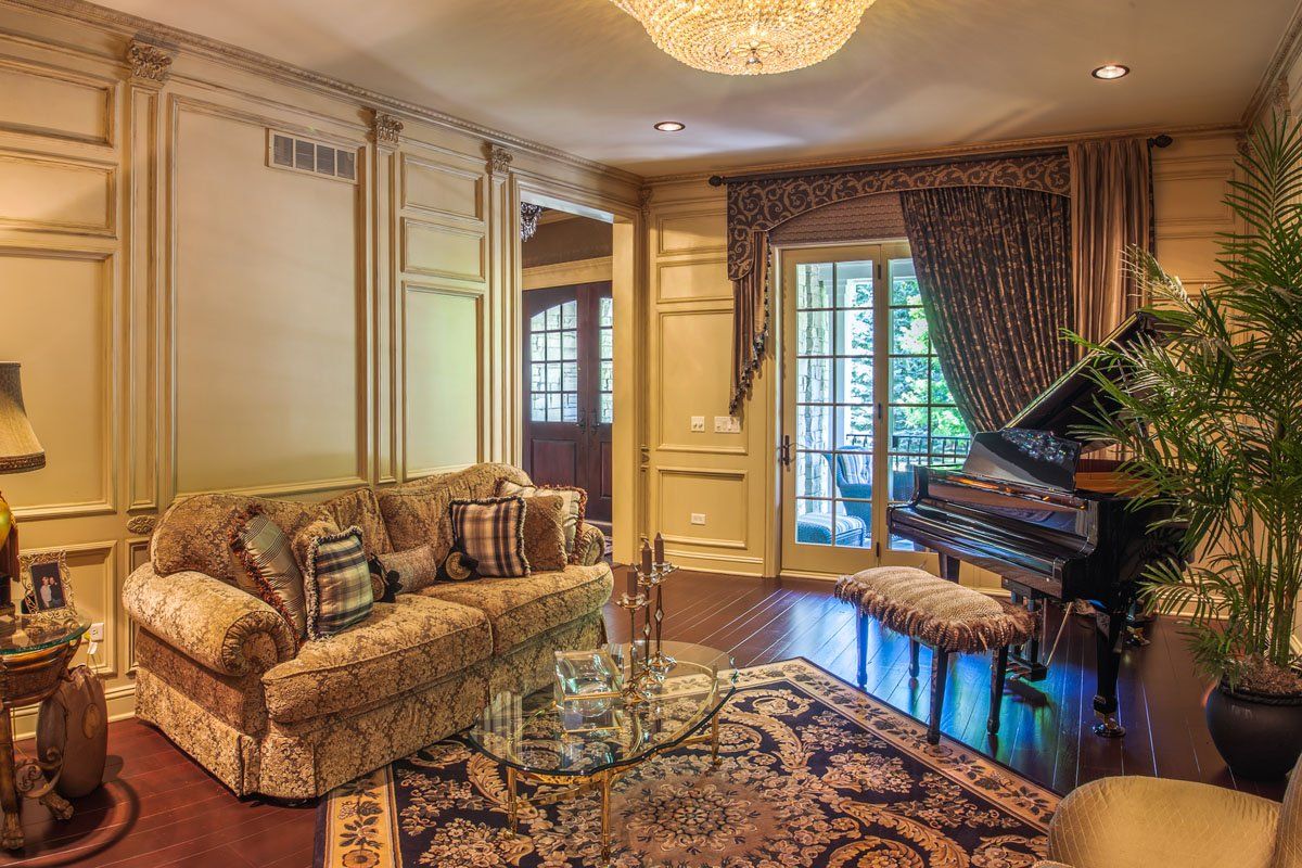A living room with a piano and a couch