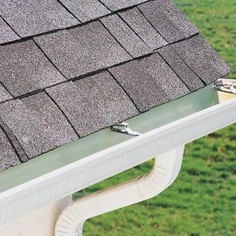 Man Fixing House Gutter — New Bern, NC — Carolina Seamless Gutter Co Man Fixing House Gutter — New Bern, NC — Carolina Seamless Gutter Co