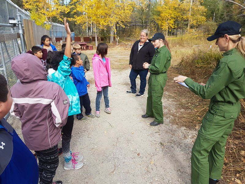 Thompson, MB: Associate Laura Dougan with schoolchildren.