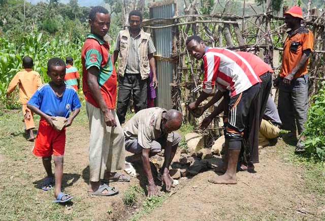 Farmers in Ethiopia dig an irrigation canal