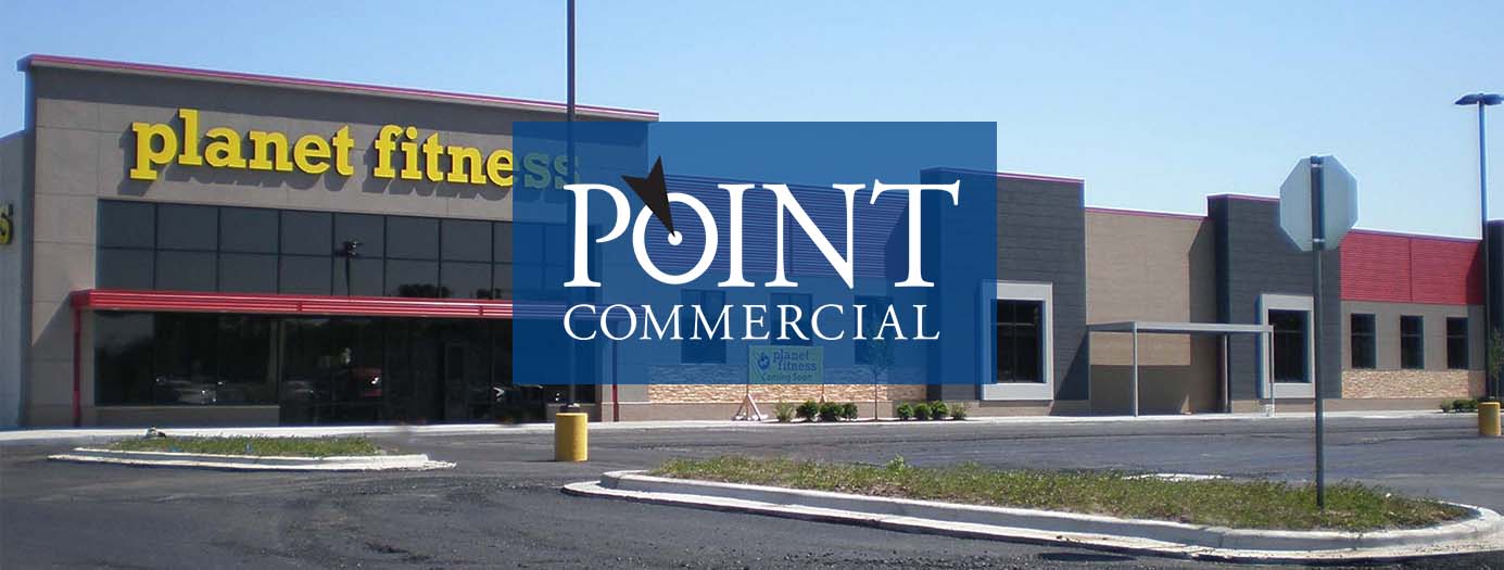 A picture of a planet fitness commercial building