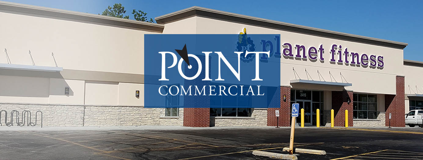 A picture of a planet fitness commercial building