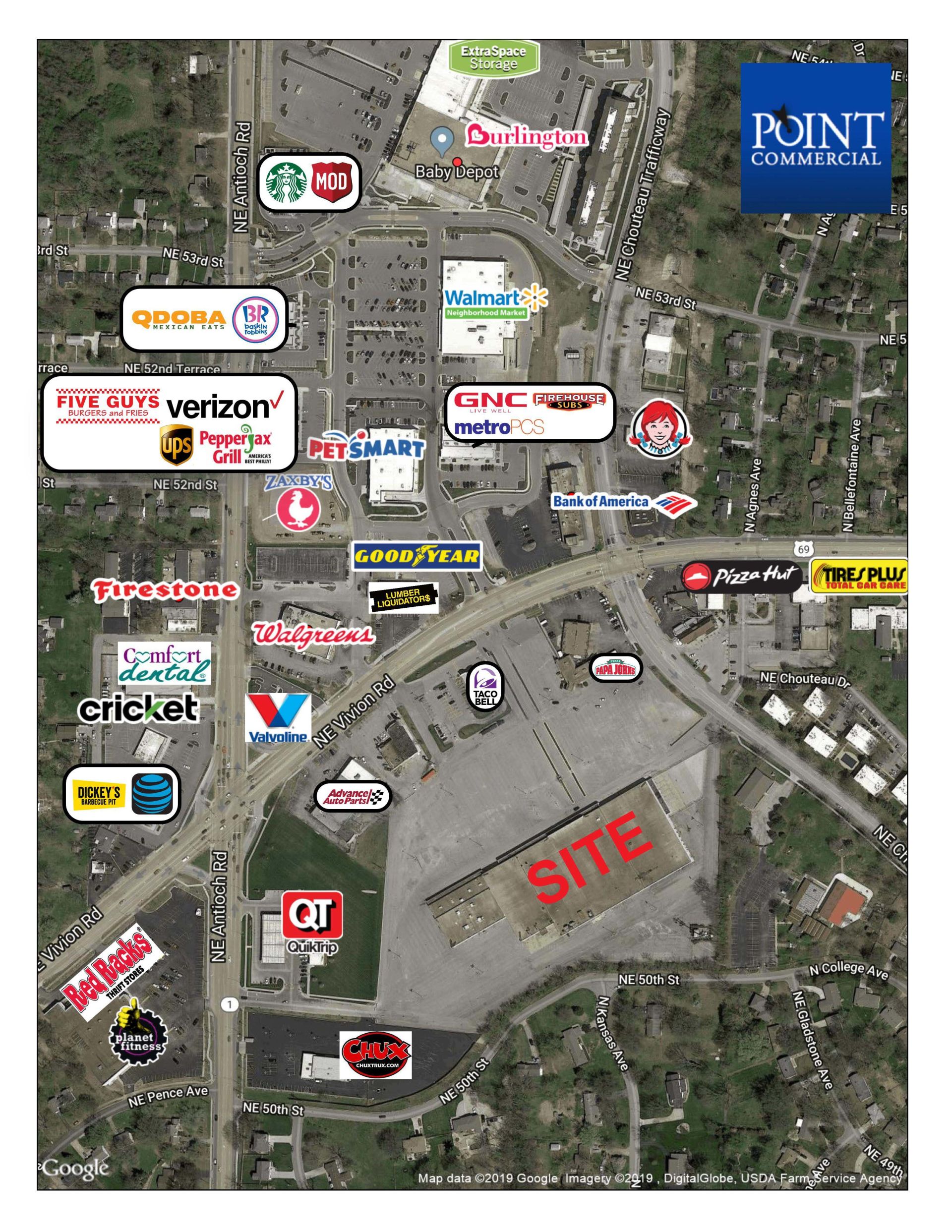 An aerial view of a shopping center with a lot of stores