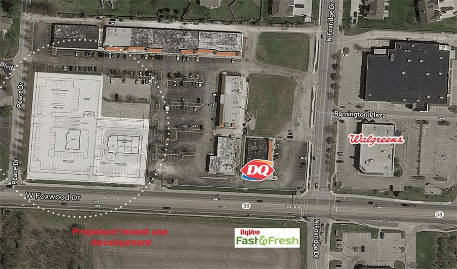 An aerial view of a city with a dairy queen restaurant in the middle
