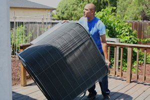 technician with A/C unit