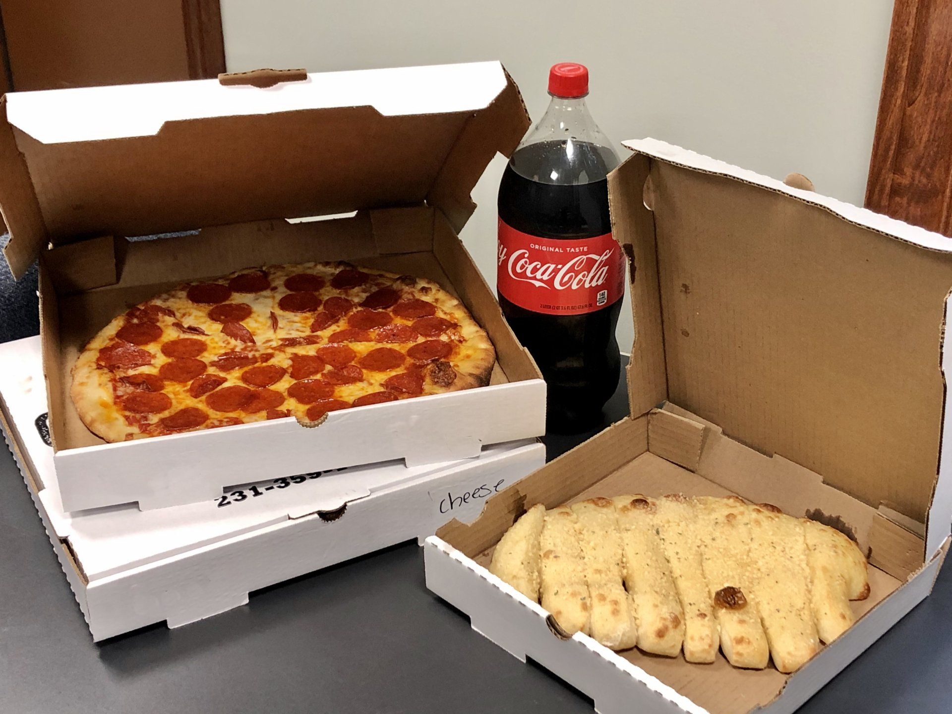 pizza, breadsticks, and pop