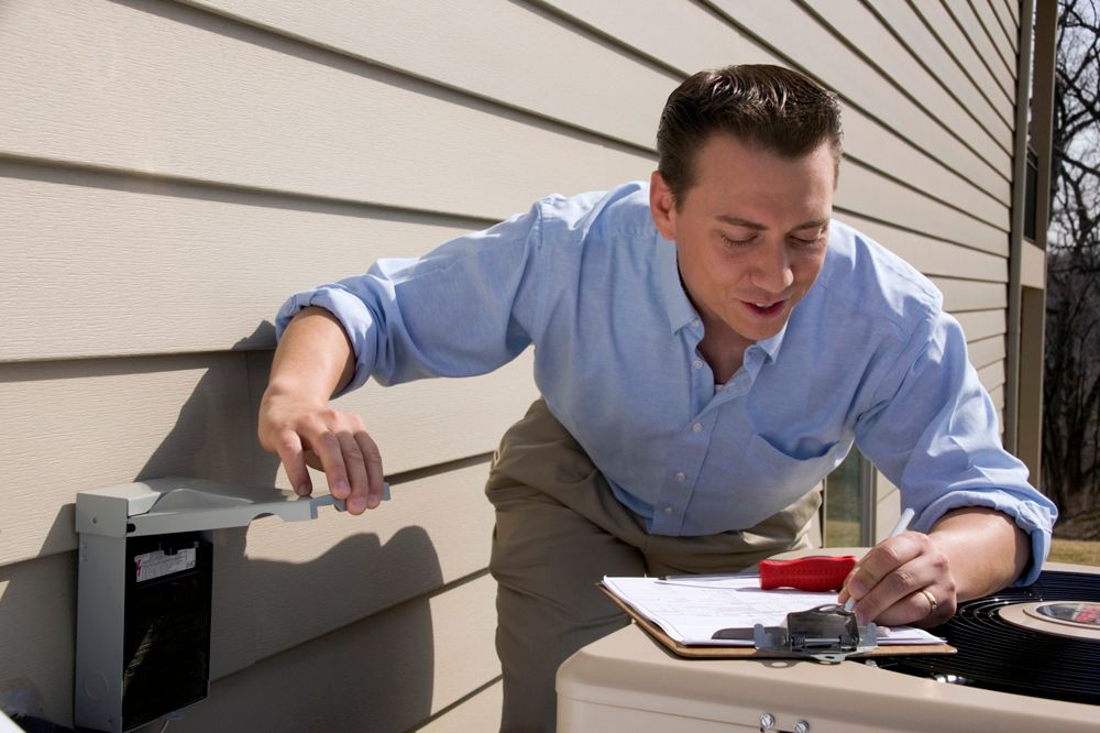 HVAC technician performing maintenance