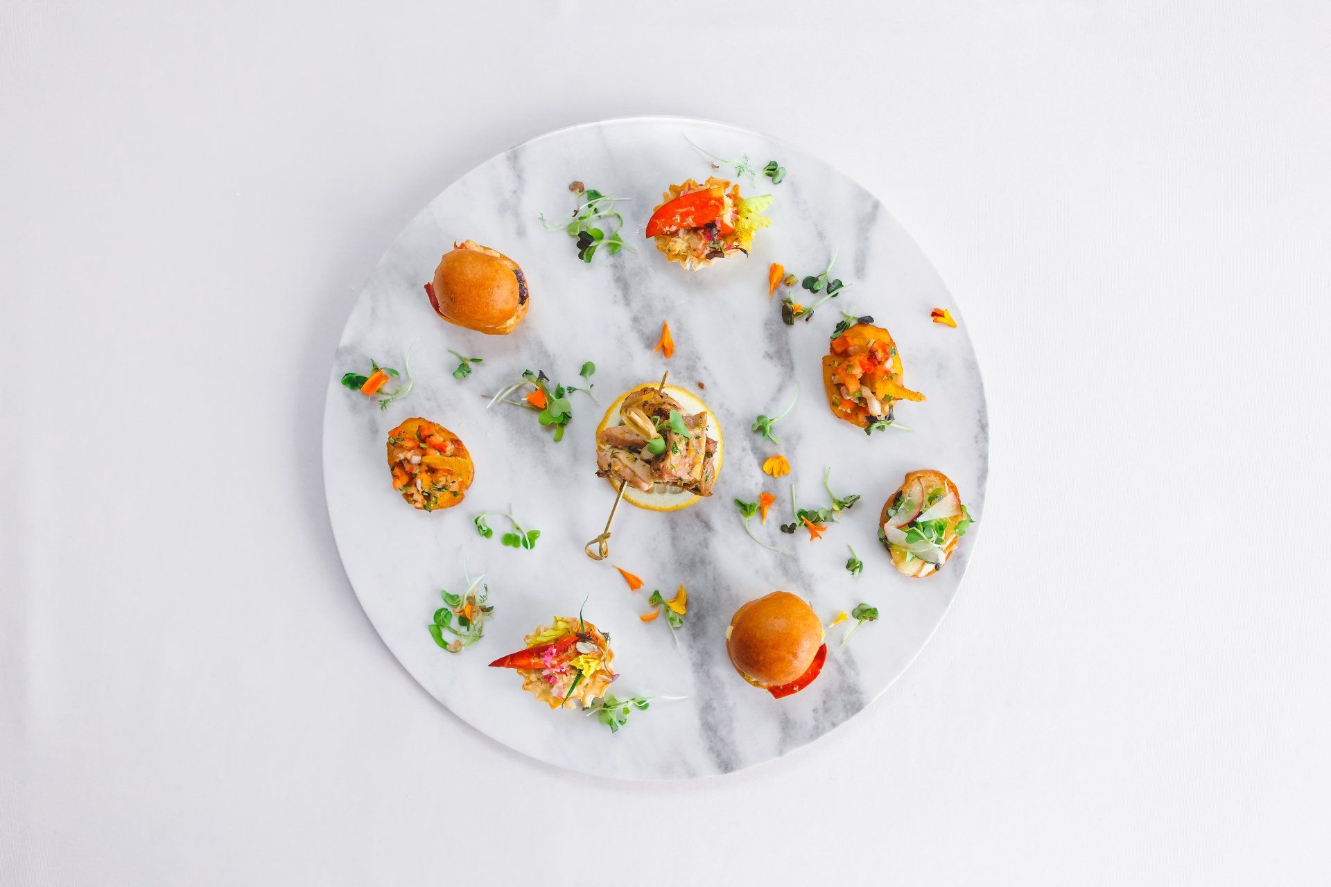 A close up of a plate of food with tostones and pico de gallo.