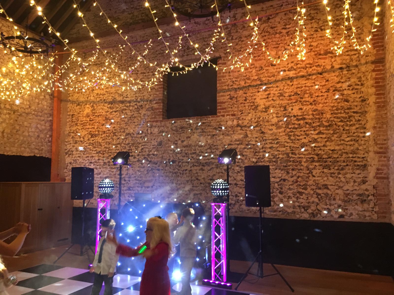 Young boy on dance floor before start of party.