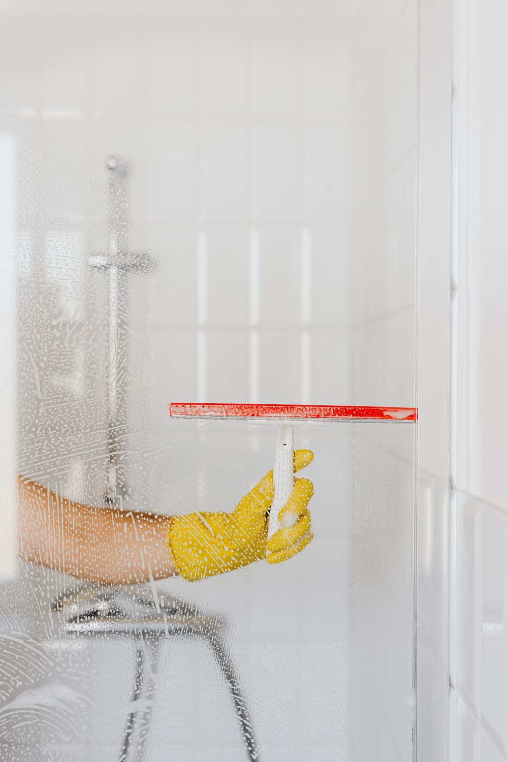 Wiping Off the Soap on the Shower Screen — DS Cleaning Services in Sunshine Coast, QLD