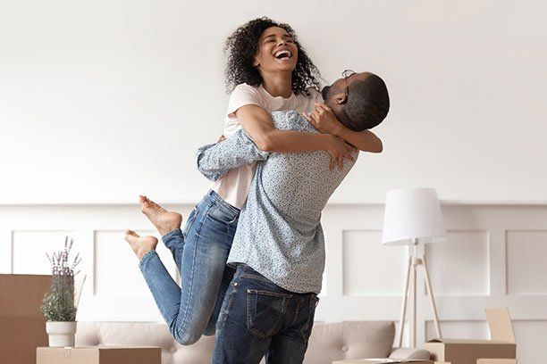 Couple Celebrating Moving Day — Belchertown, MA — Law Offices of Richard H Maynard PC Couple Celebrating Moving Day — Belchertown, MA — Law Offices of Richard H Maynard PC