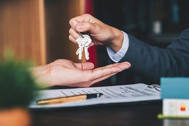 Keys being Handed Over — Belchertown, MA — Law Offices of Richard H Maynard PC Keys being Handed Over — Belchertown, MA — Law Offices of Richard H Maynard PC