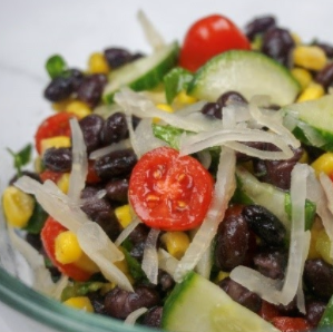 Black bean salad with tomatoes, cucumber, corn, and shaved onion.